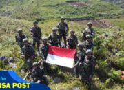 Cinta Tanah Air dan Patriotisme Ditunjukan Satgas Yonif 641/Bru melalui Pengibaran Bendera Merah Putih di Bukit Palesi