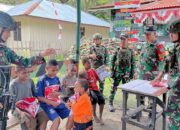 TNI Berbagi Kebahagiaan : Anak-Anak Papua Senyum Ceria Menerima Baju Baru Dari Satgas Yonif 641/Bru