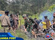Satgas TNI Ikut Berpartisipasi dalam Kegiatan Bakar Batu di Kampung Amungi Distrik Ilaga Utara.